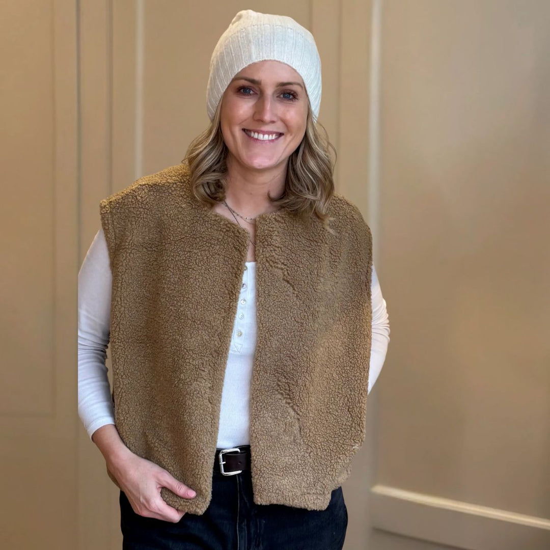 Caramel boxy fleece gilet from LNH Edit, styled by founder Laura with a white top and beanie.