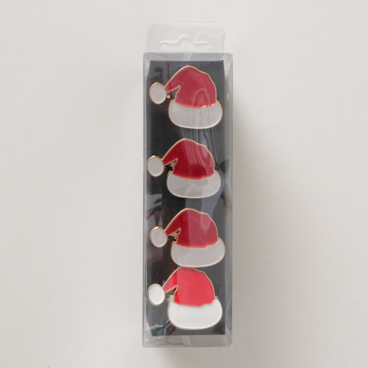Set of four Santa hat napkin rings in clear festive packaging, perfect for gifting.