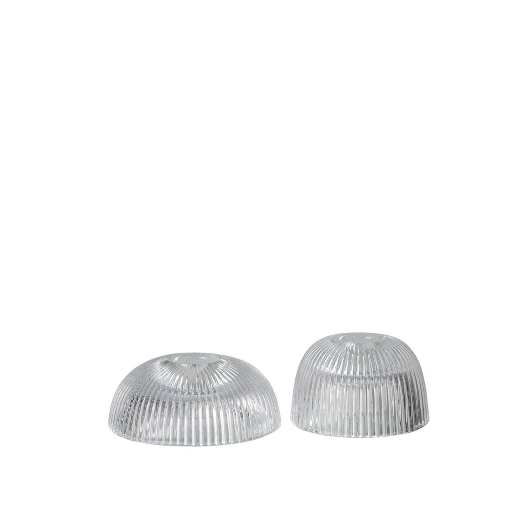 Set of two ribbed clear glass candle holders.