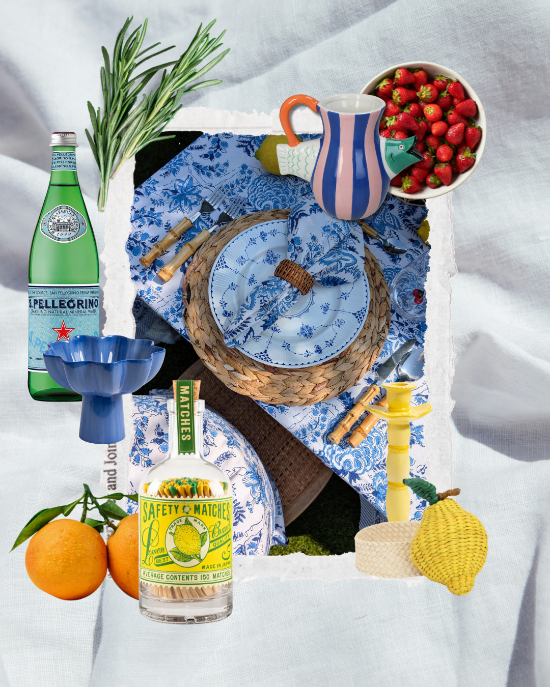Amalfi-inspired late summer tablescape with blue block print linens, woven chargers, citrus accents, strawberries, San Pellegrino, and artisan tableware.