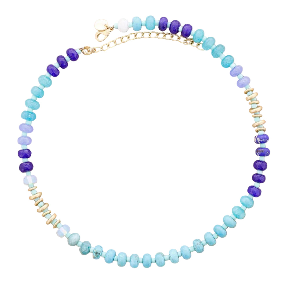 Beaded necklace with blue, purple, and gold beads on a beige background