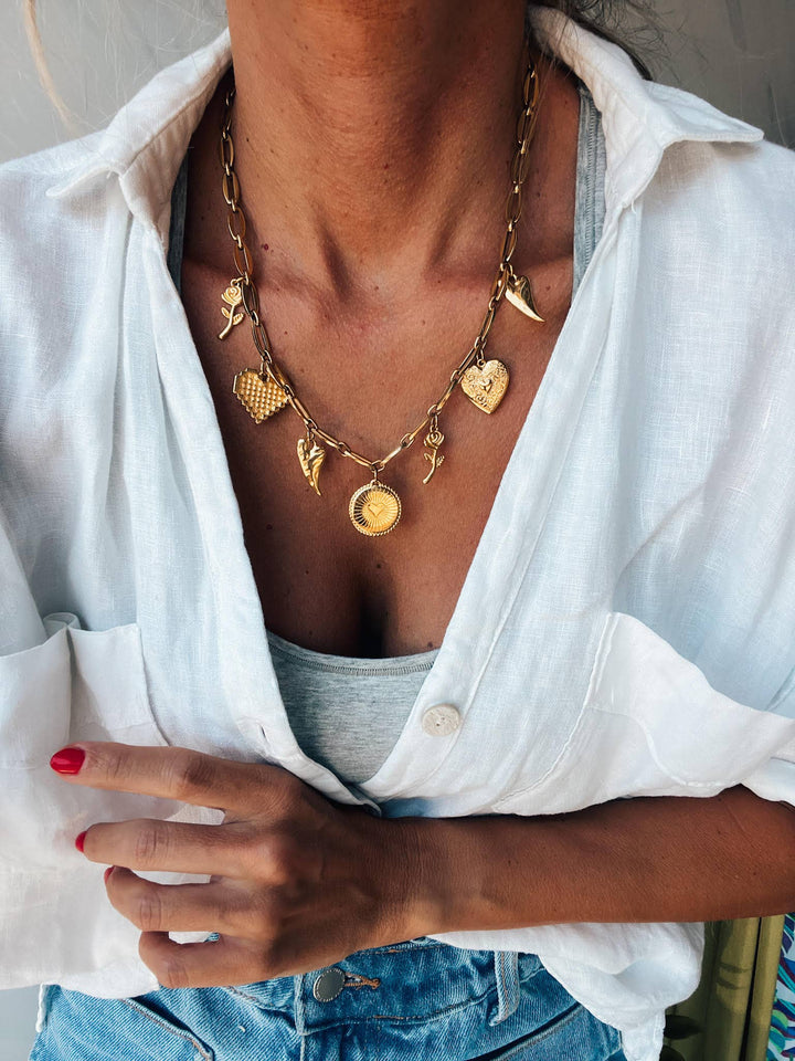 Gold charm necklace with hearts and roses