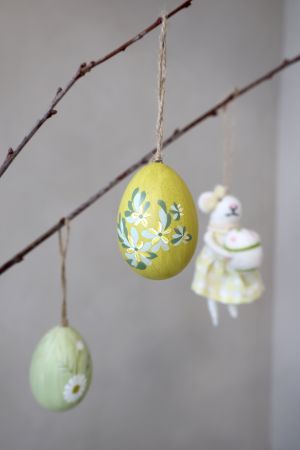 Yellow easter egg with hand painted flowers