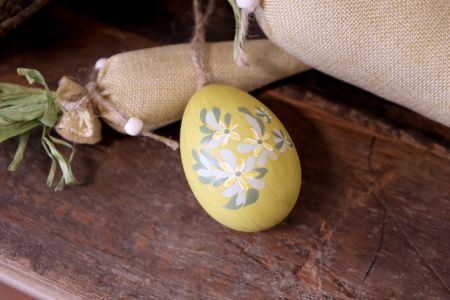 Yellow easter egg with hand painted flowers