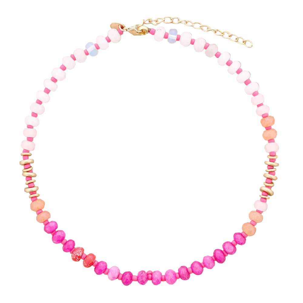 Necklace with pink, white, and orange beads on a beige background