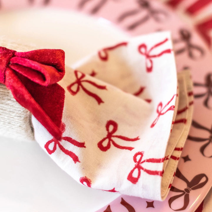 Red bow print napkin on pink plate, handmade cotton Christmas napkin by LNH Edit.