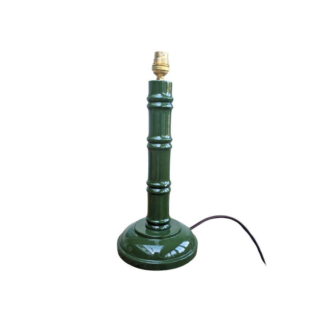 Green hand-painted bamboo lamp base with gold bulb fitting on a white background.
