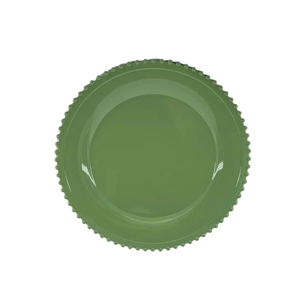 Green beaded charger plate with scalloped edge, styled on festive LNH Edit table with patterned napkins and gold cutlery.