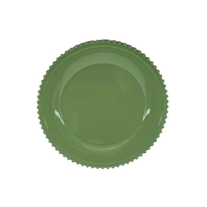 Green beaded charger plate with scalloped edge, styled on festive LNH Edit table with patterned napkins and gold cutlery.