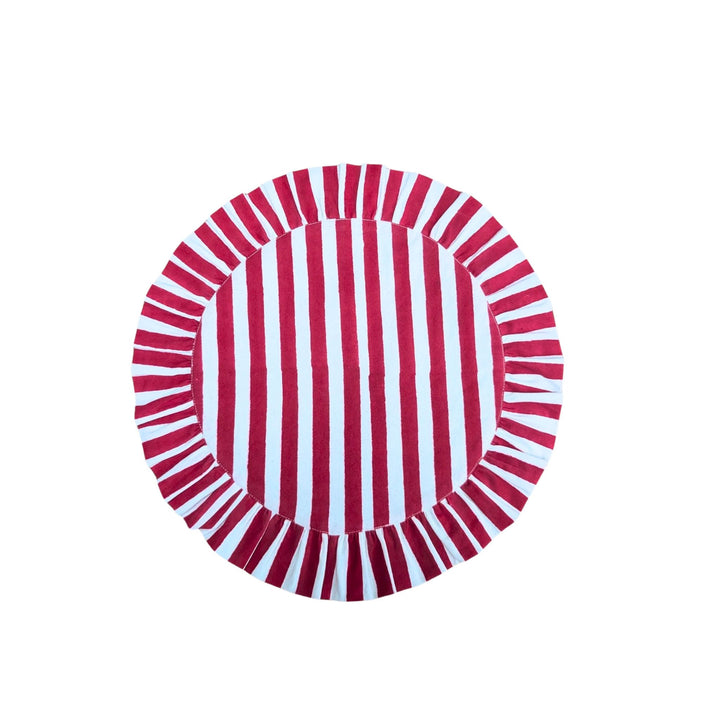 LNH Edit Holly Red Frill Table Runner in hand block-printed cotton with red and white stripes and frilled border, styled on festive table setting.