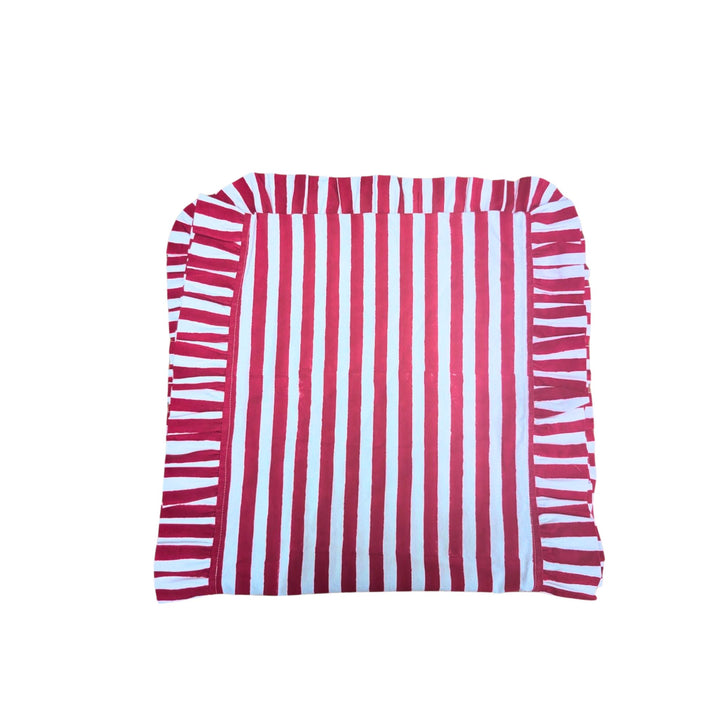 LNH Edit Holly Red Frill Table Runner in hand block-printed cotton with red and white stripes and frilled border, styled on festive table setting.