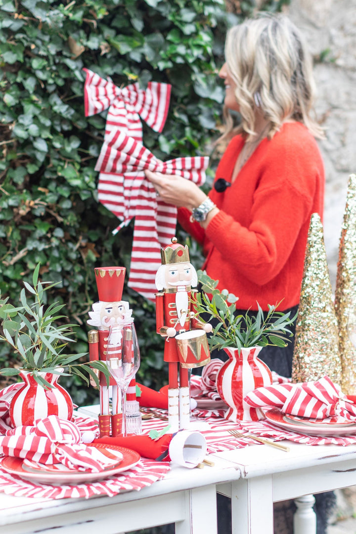 “LNH Edit Holly Red Striped Napkins, set of 4 hand block-printed cotton napkins styled with festive table setting.”