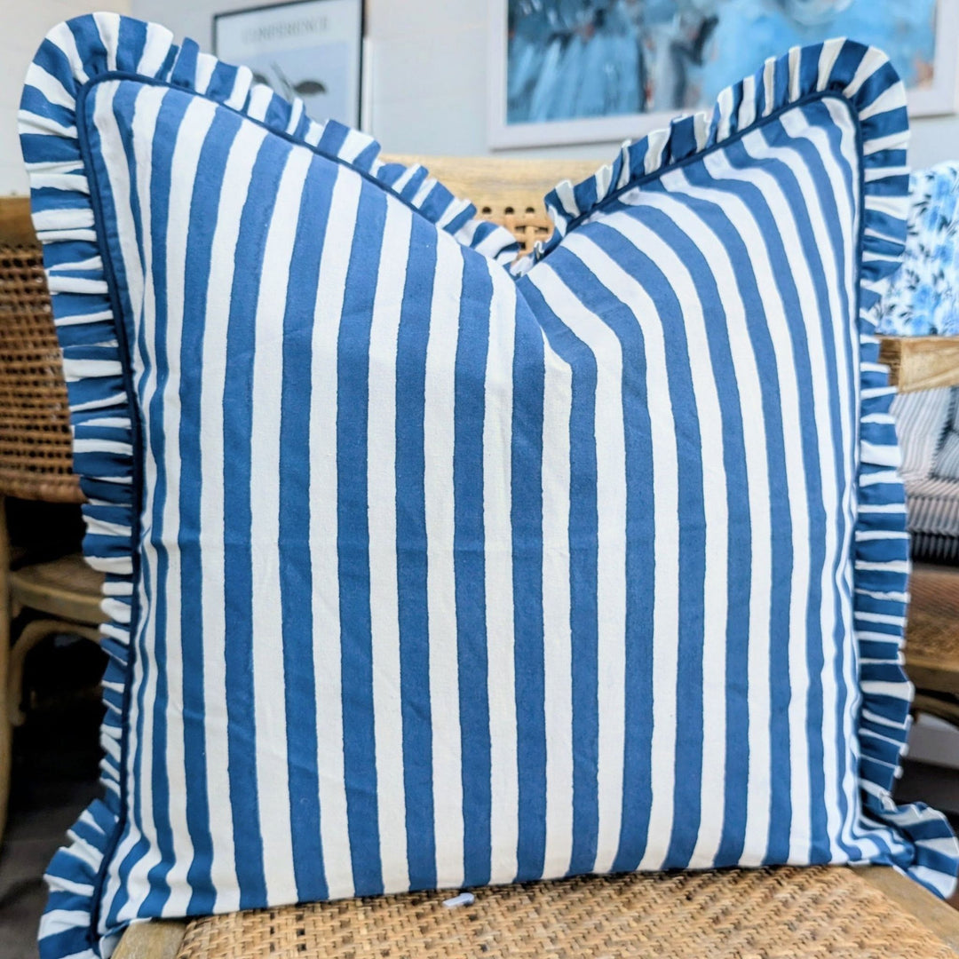 LNH Edit Iris blue and white frill cushion cover, hand block printed cotton cushion styled in blue-toned interior.