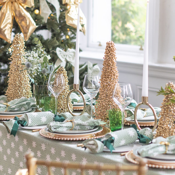 Elegant green and gold Christmas table styled with reusable crackers from The LNH Edit.