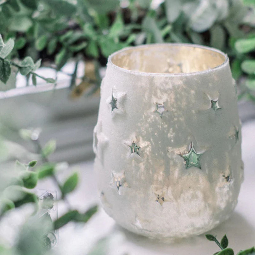 Star cut-out frosted glass tealight holder in antique silver finish by LNH Edit.