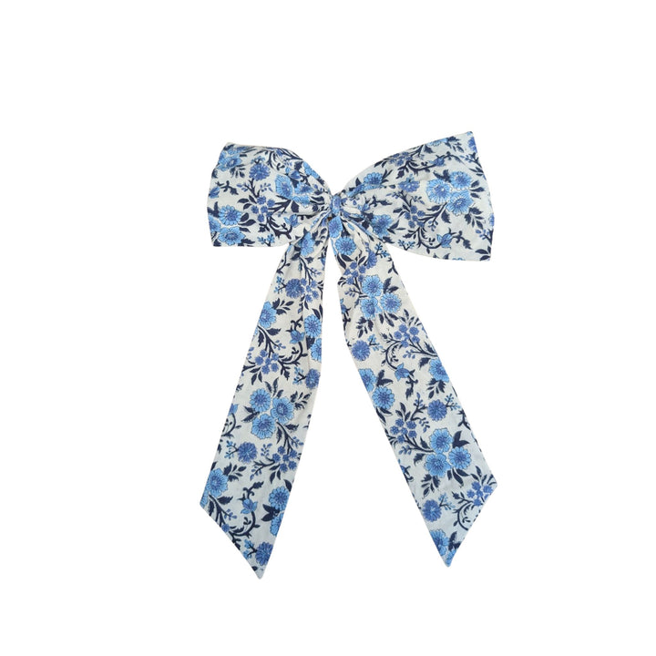 LNH Edit Thistle Blue Handmade Bow in hand block-printed cotton with blue floral pattern.