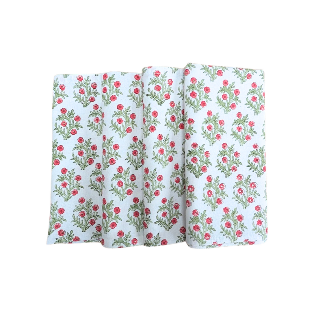 Set of four hand block printed green and red floral Christmas napkins.