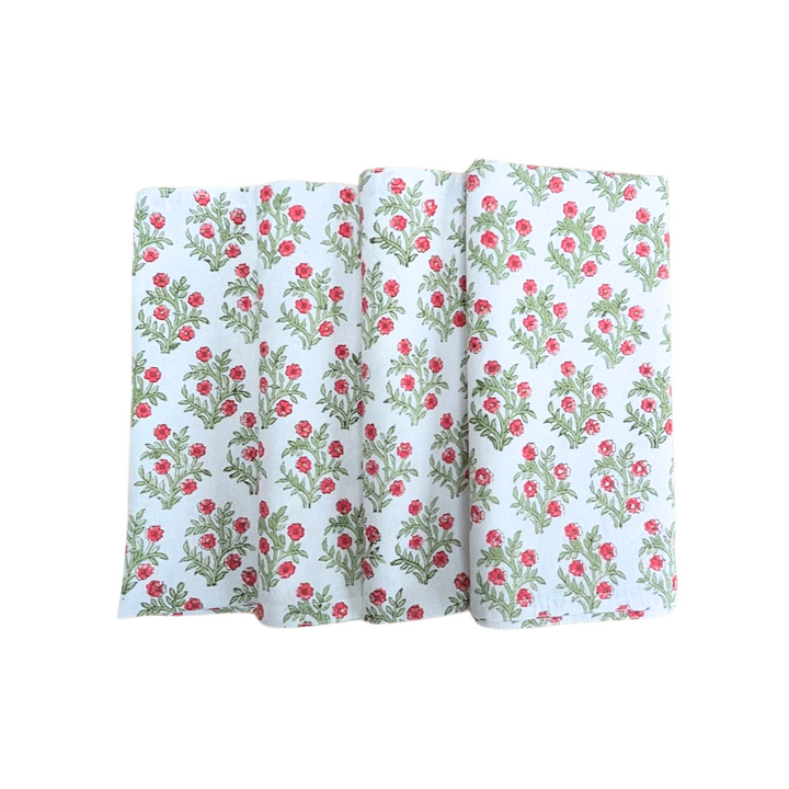 Set of four hand block printed green and red floral Christmas napkins.