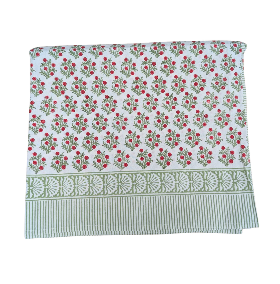 Close-up of Lily Christmas tablecloth pattern and border detail.
