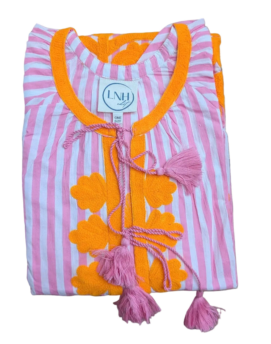 Pink and orange striped  dress garment with floral patterns and tassels 
