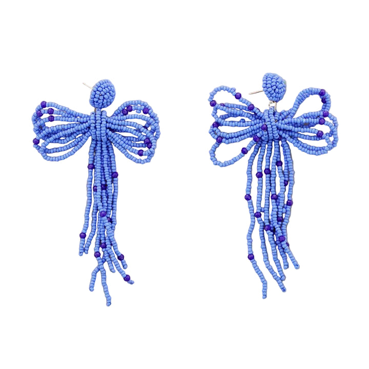 Pair of blue beaded bow earrings on a white background