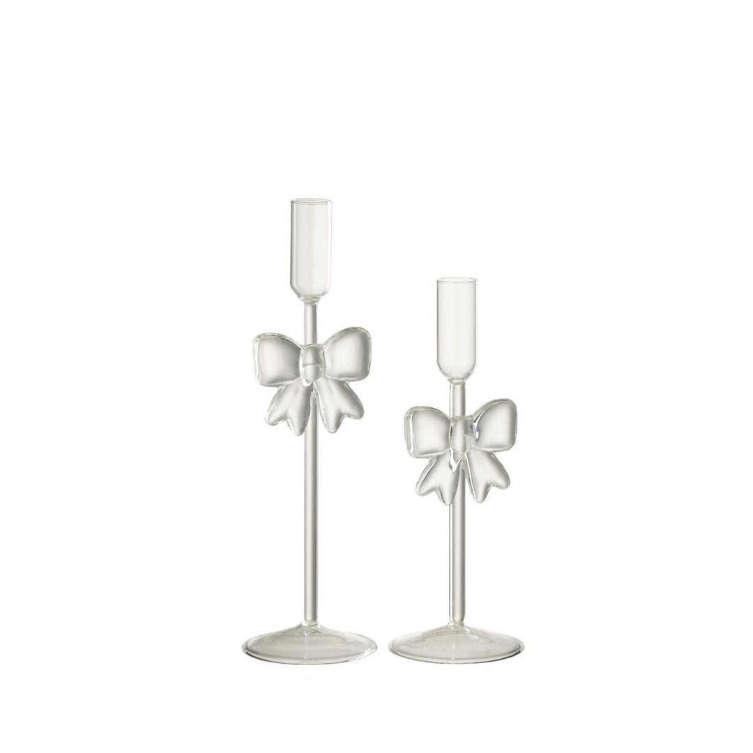 Set of two transparent glass candle holders with sculptural bow design, elegant festive décor.