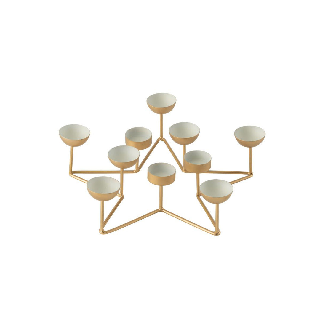 Gold metal star tealight holder with white interiors.