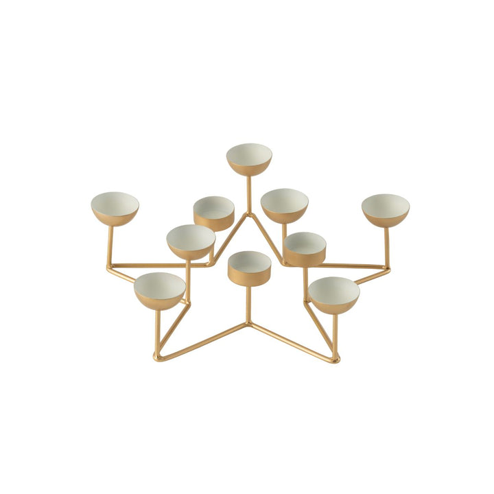 Gold metal star tealight holder with white interiors.