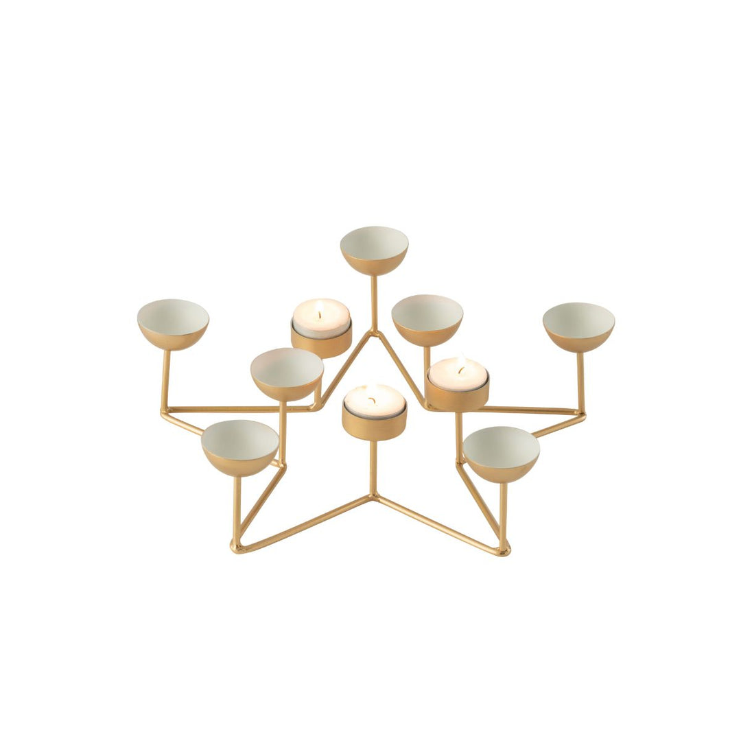 Gold star tealight holder with several tealights lit.