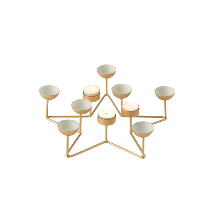 Gold star tealight holder with several tealights lit.