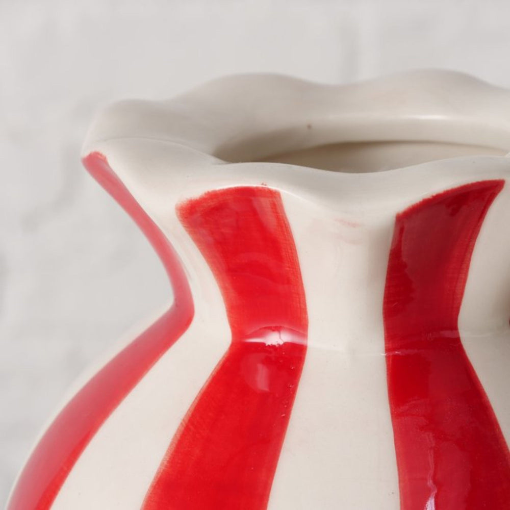 Detail of glossy red and white hand-painted stripes on Bonbon vase.