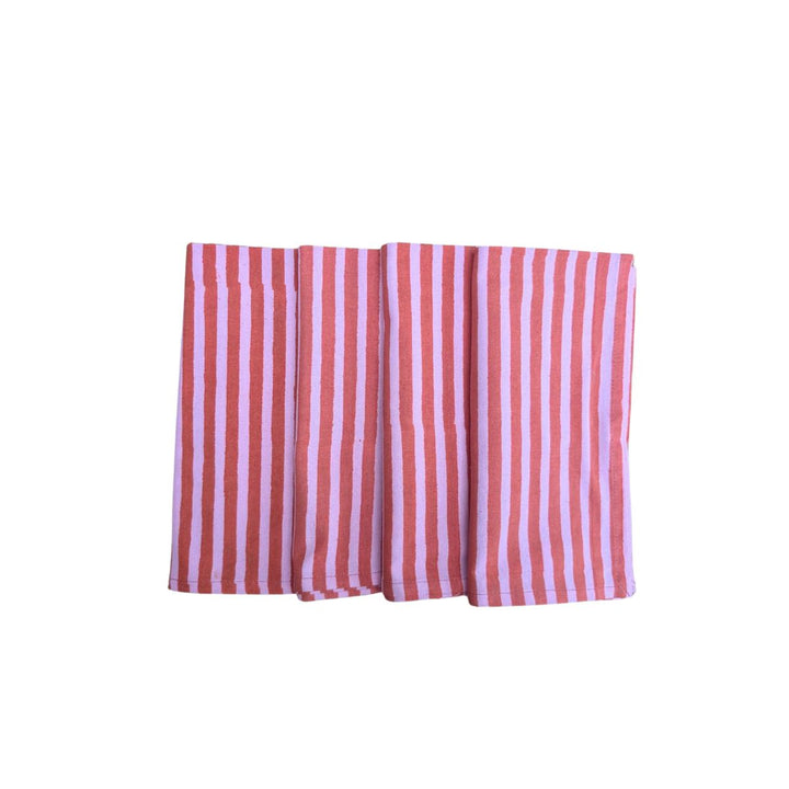 Set of four handmade red and pink striped cotton napkins, block-printed on soft white fabric.