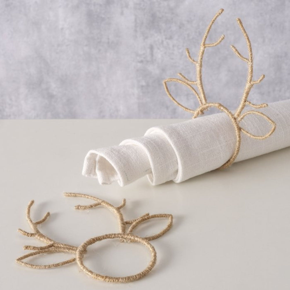 Festive table styling with reindeer antler napkin rings and white linen napkins from LNH Edit.