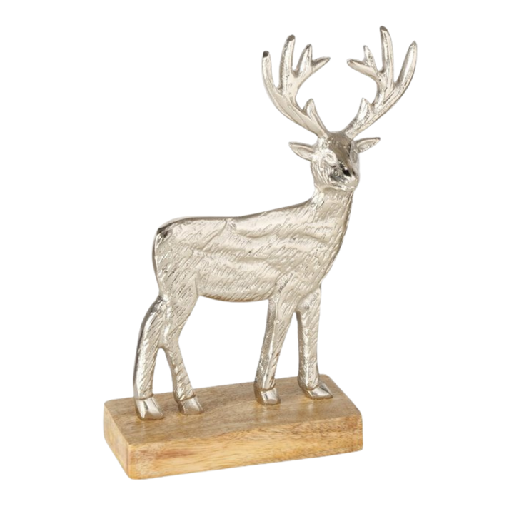 Small silver reindeer figurine on mango wood base from LNH Edit.