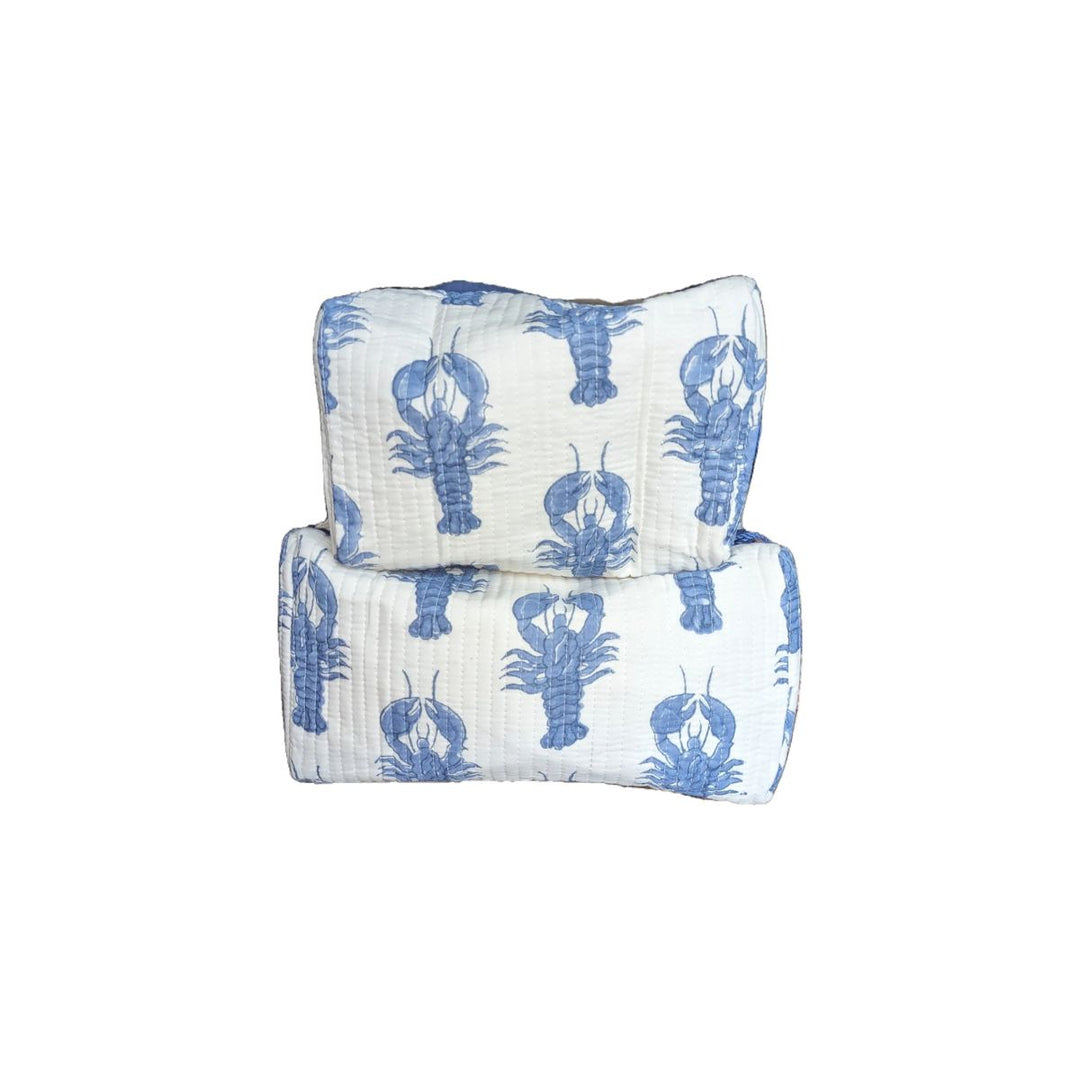 Set of two quilted cotton cosmetic bags with blue lobster print on white fabric.