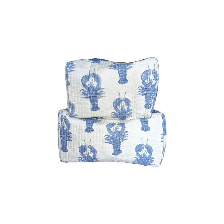 Set of two quilted cotton cosmetic bags with blue lobster print on white fabric.