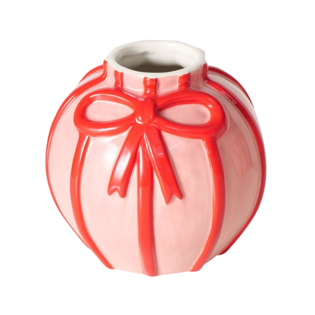 Pink ceramic vase with red embossed bow design by LNH Edit.
