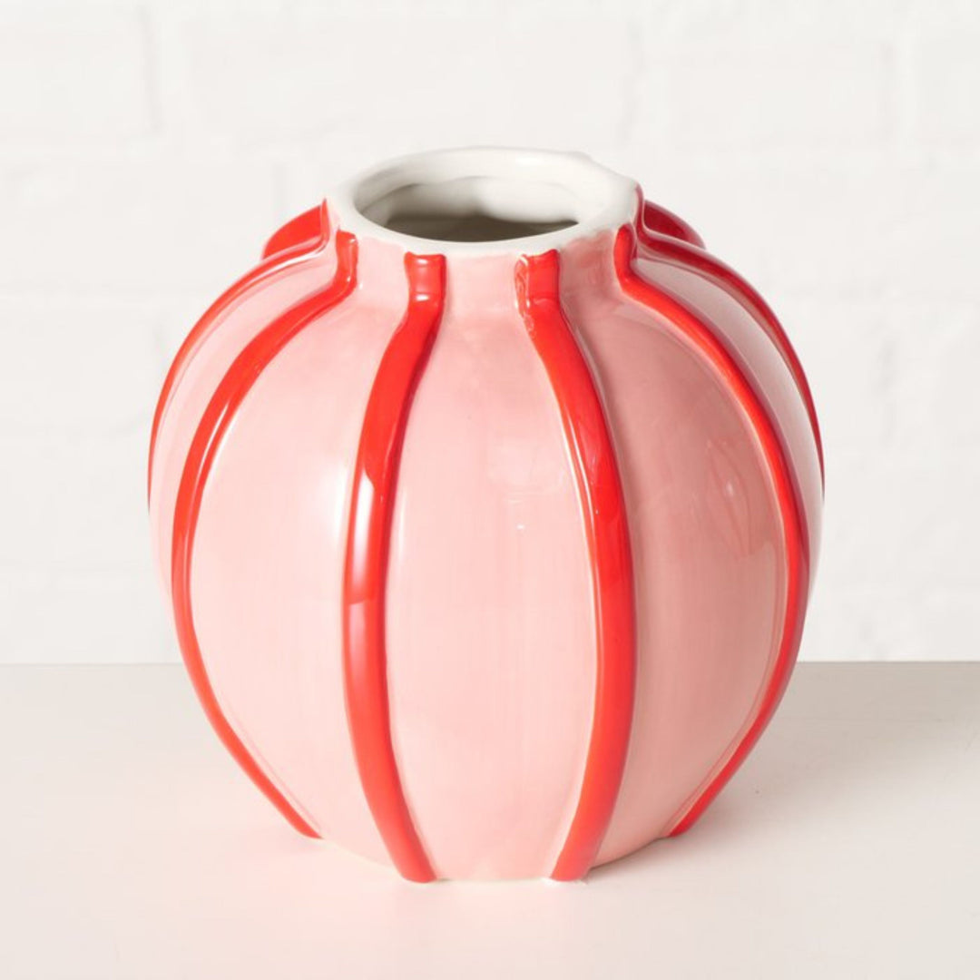 Back view of round pink and red ceramic Volta vase with glossy finish.