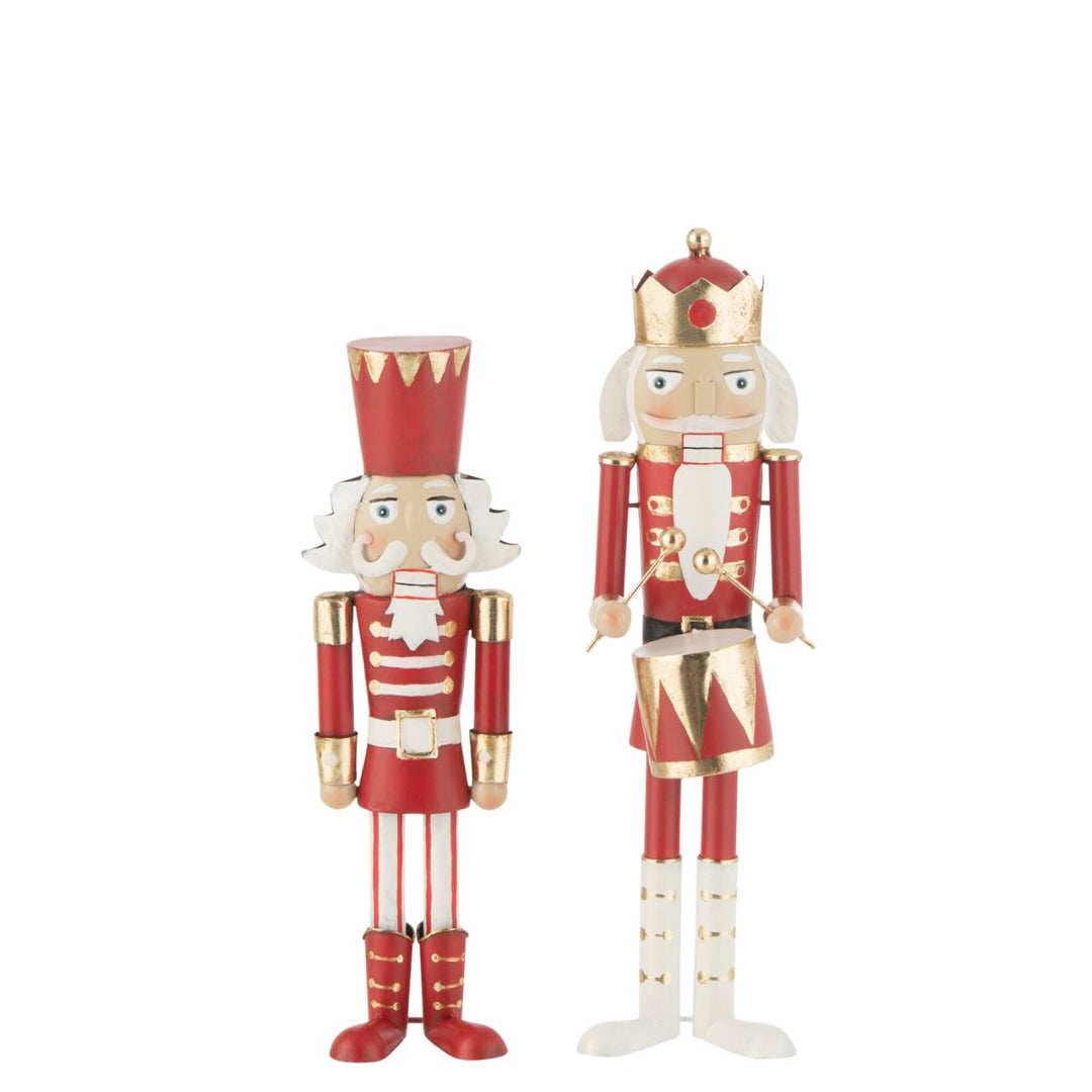 Set of two red and gold metal nutcracker figures standing upright.