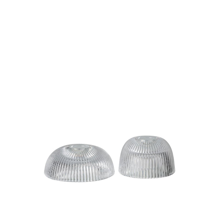 Set of two ribbed clear glass candle holders.