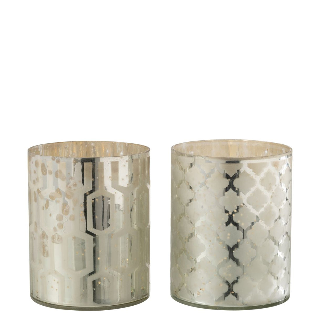 Set of two silver patterned glass hurricane candle holders with geometric and lattice designs.